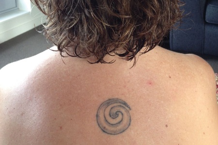 Maori tattoo on upper back