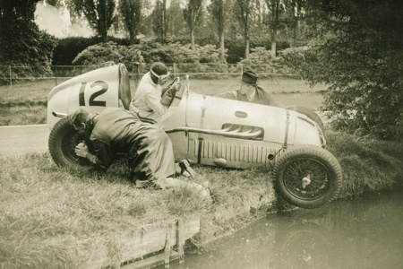 Sepia photo of racing car racers