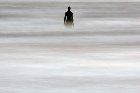 Silhouette standing in sea
