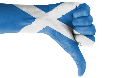 Hand with thumb down painted with Scottish flag