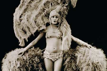 Young female dancer dressed in feathers