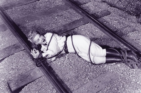 Woman tied up on train tracks