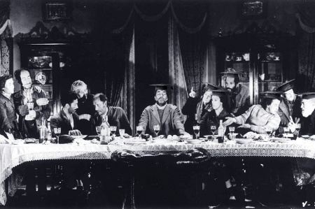 People sitting at dining table (black and white)