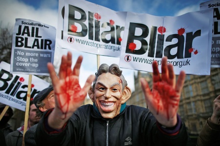 Man wearing a Tony Blair face mask