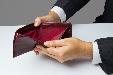 Man holding empty wallet