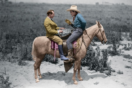 Two men playing checkers on back of horse