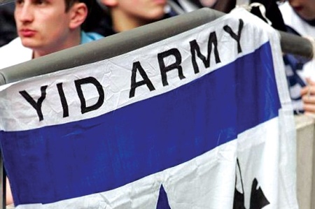 Man holding 'Yid Army' flag