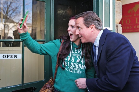 Girl taking a selfie with David Cameron