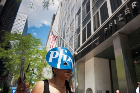 Woman protesting outside Pfizer offices