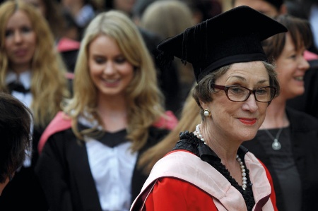 Dame Carol Black with female university graduates