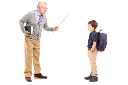 Teacher disciplining schoolboy